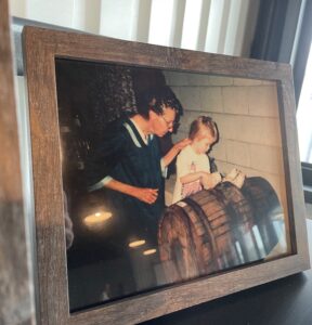 Krystal with her grandmother making wine from farm-grown fruits
